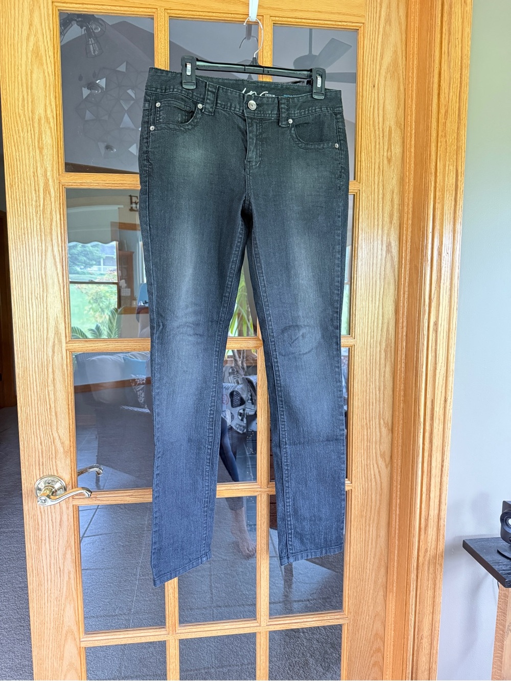 INC International Concepts faded black jeans for women.